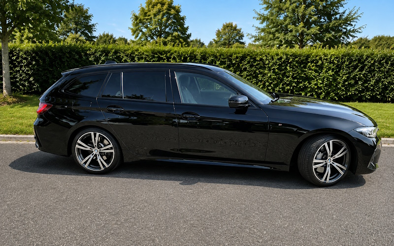 The grey BMW 3 Series Touring purchased by Thomas